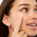 Teenager holding Kinside Magic Blemish Serum