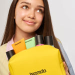 Kinside Let's Go cosmetic bag packed with skincare