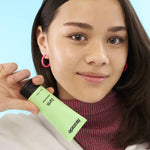 Teenager applying Kinside Earth Exfoliating Mask