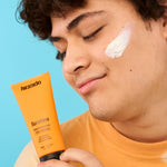 Teenager holding Kinside Sunshine Daily Defence SPF50+ sunscreen
