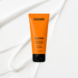 Sunshine Daily Defence SPF50+ sunscreen on a coloured background