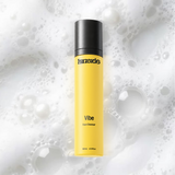 Vibe Face Cleanser bottle on a coloured background